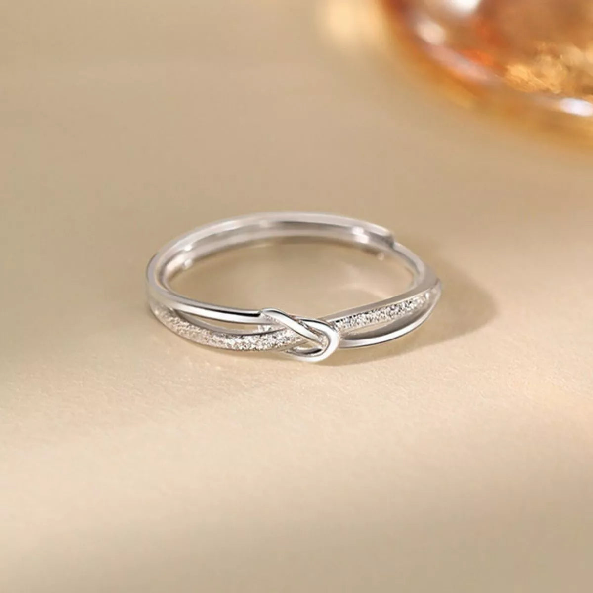 Sterling silver zircon knot ring full length view