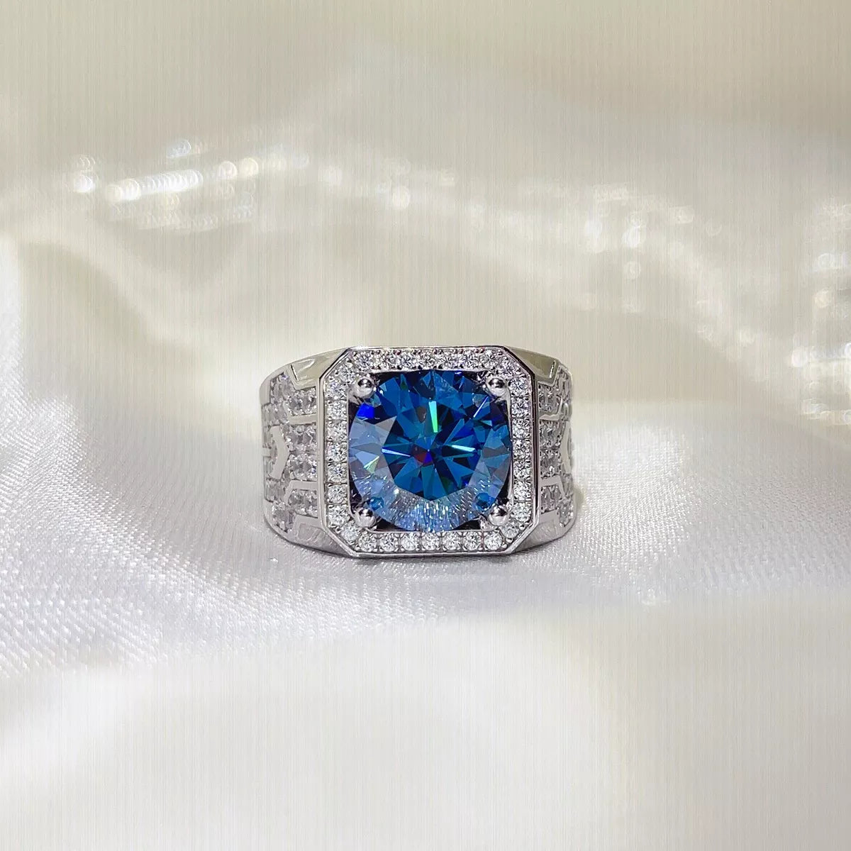 Blue stone ring worn on a hand to show scale
