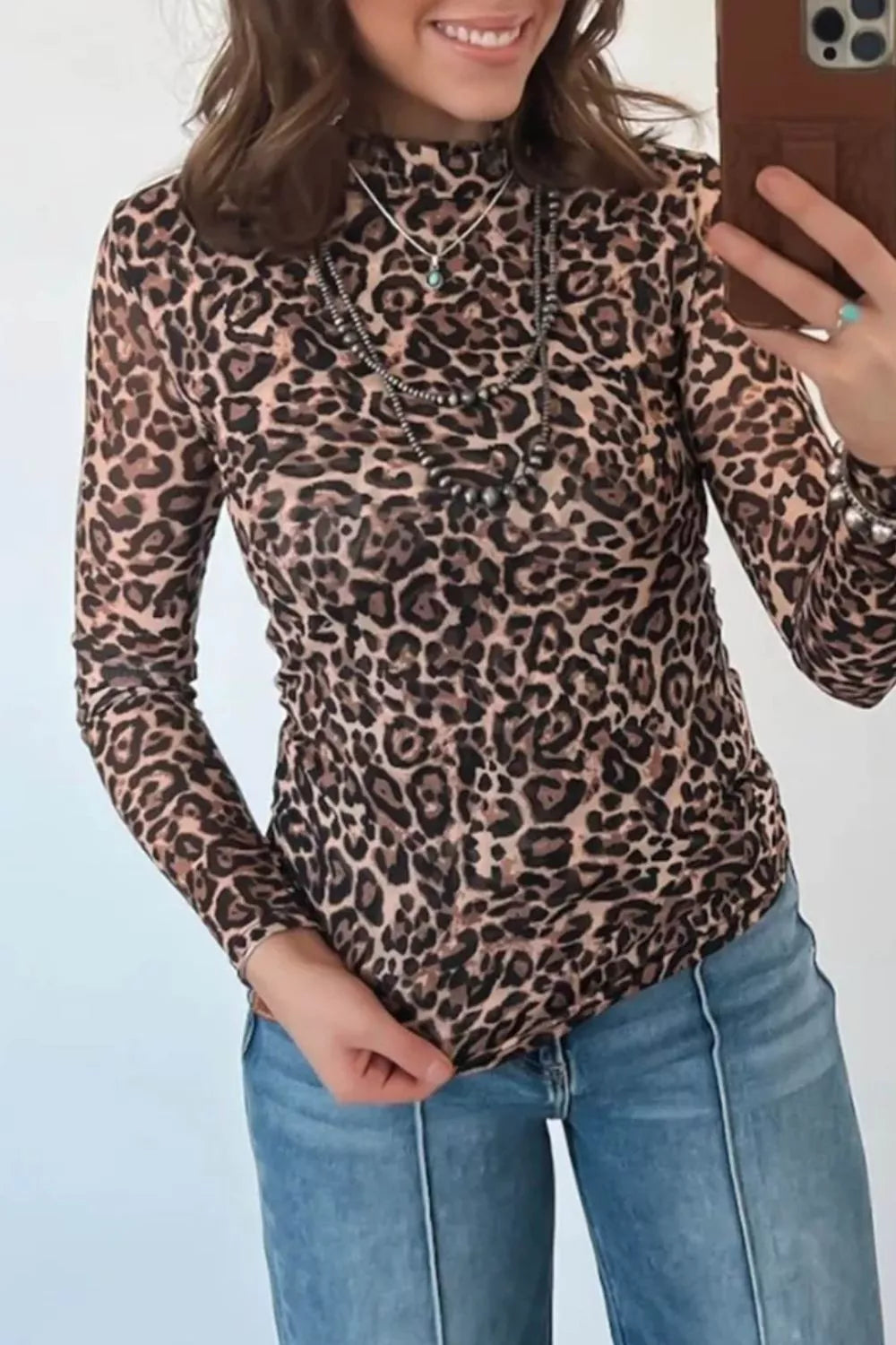 Olive brown leopard top shown from the back