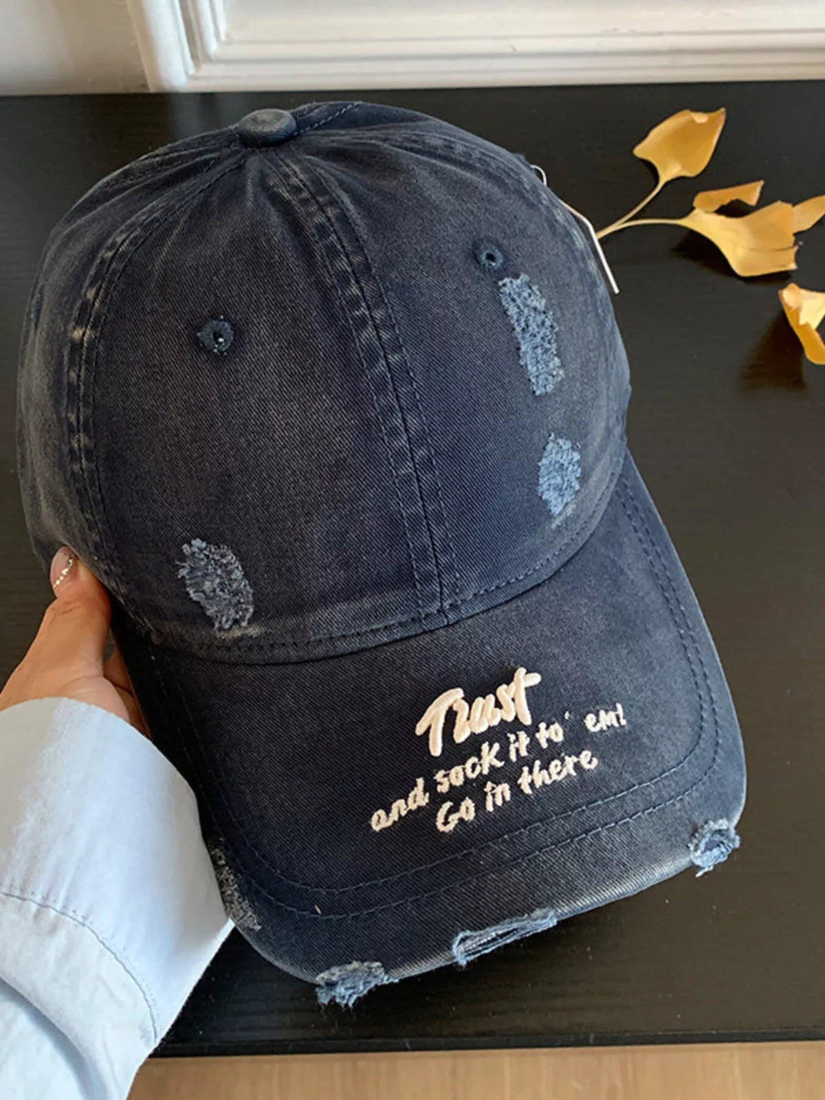 The distressed cap shown in an alternate colorway