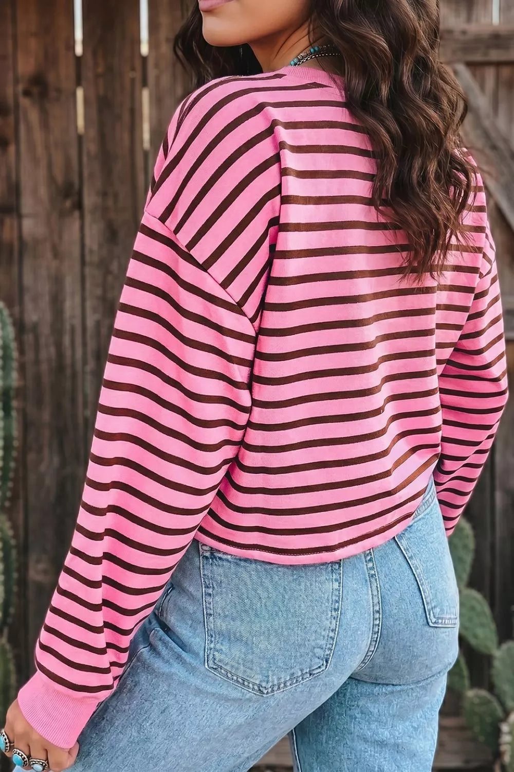 Sleeve and cuff detail of the striped long sleeve top