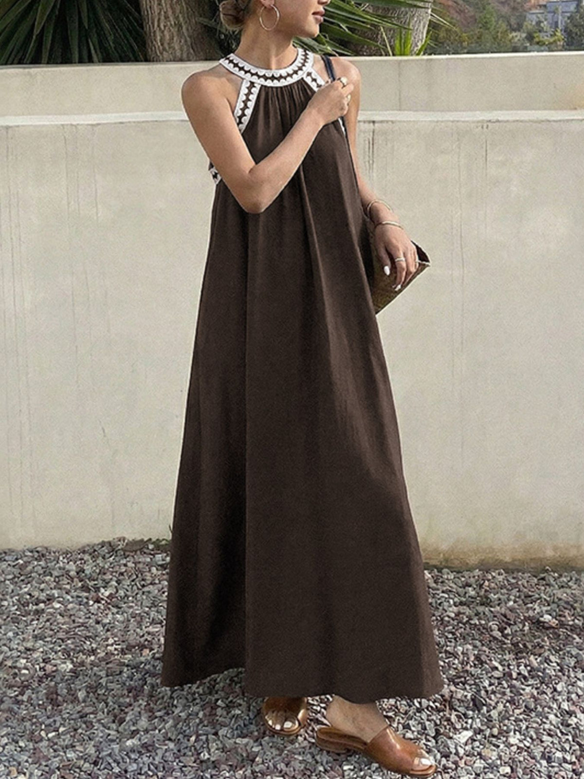 Neckline and bodice of the sleeveless brown maxi dress