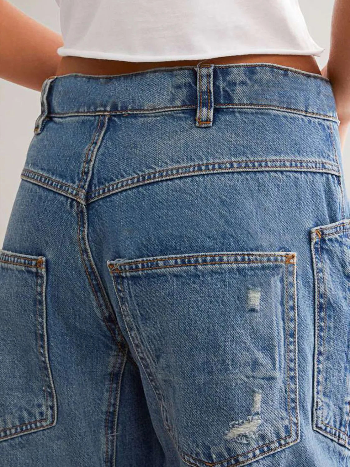 Back view of distressed straight jeans