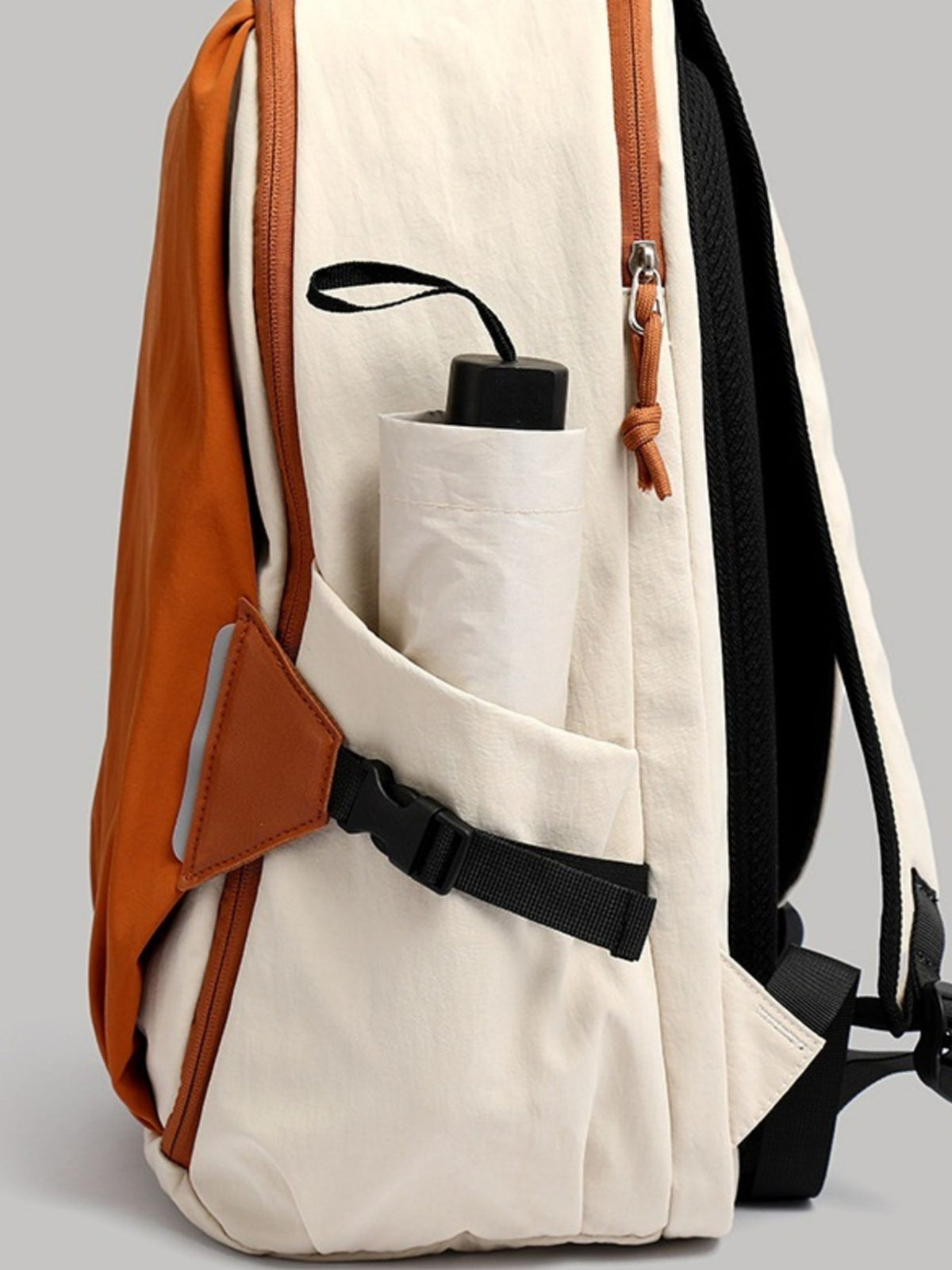 Orange color block nylon backpack zip and hardware detail