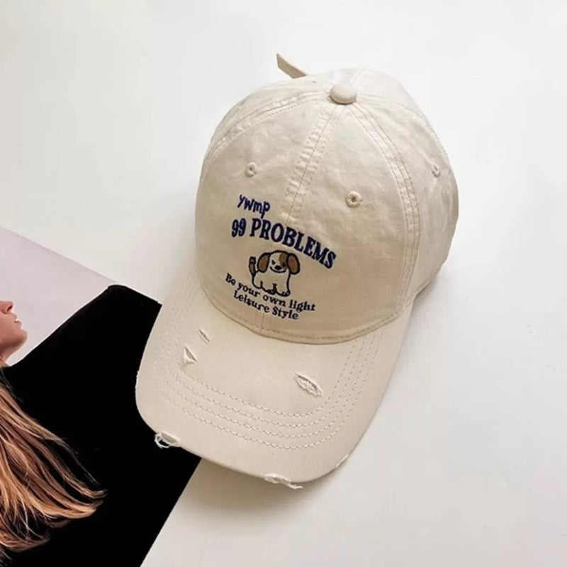 Distressed cotton baseball cap with dog motif, front view