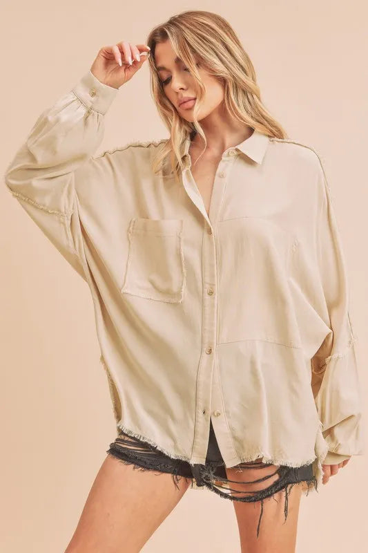 Oatmeal raw edge exposed seam collared shirt front view on model