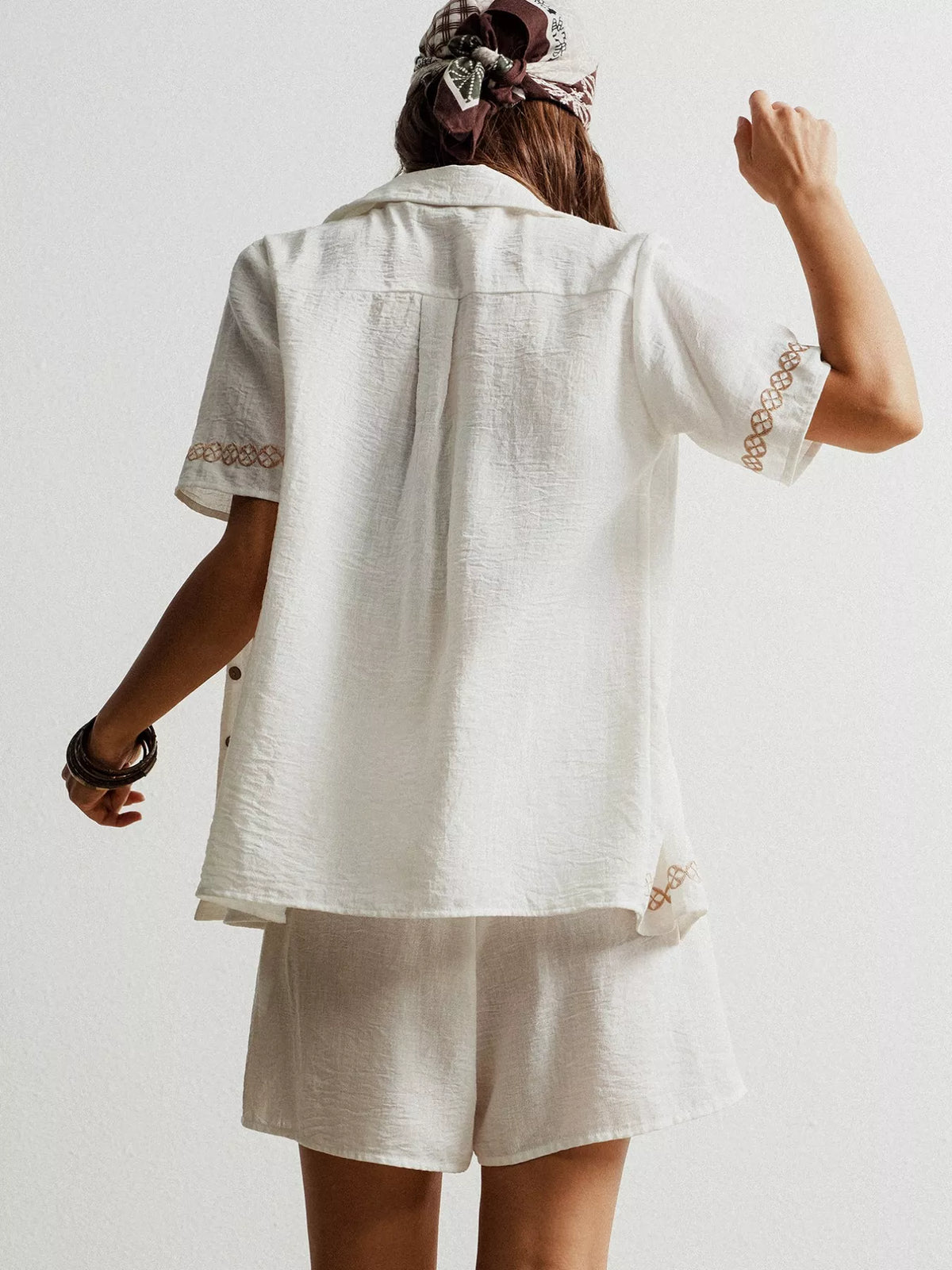 Close up of white button up short sleeve shirt detail