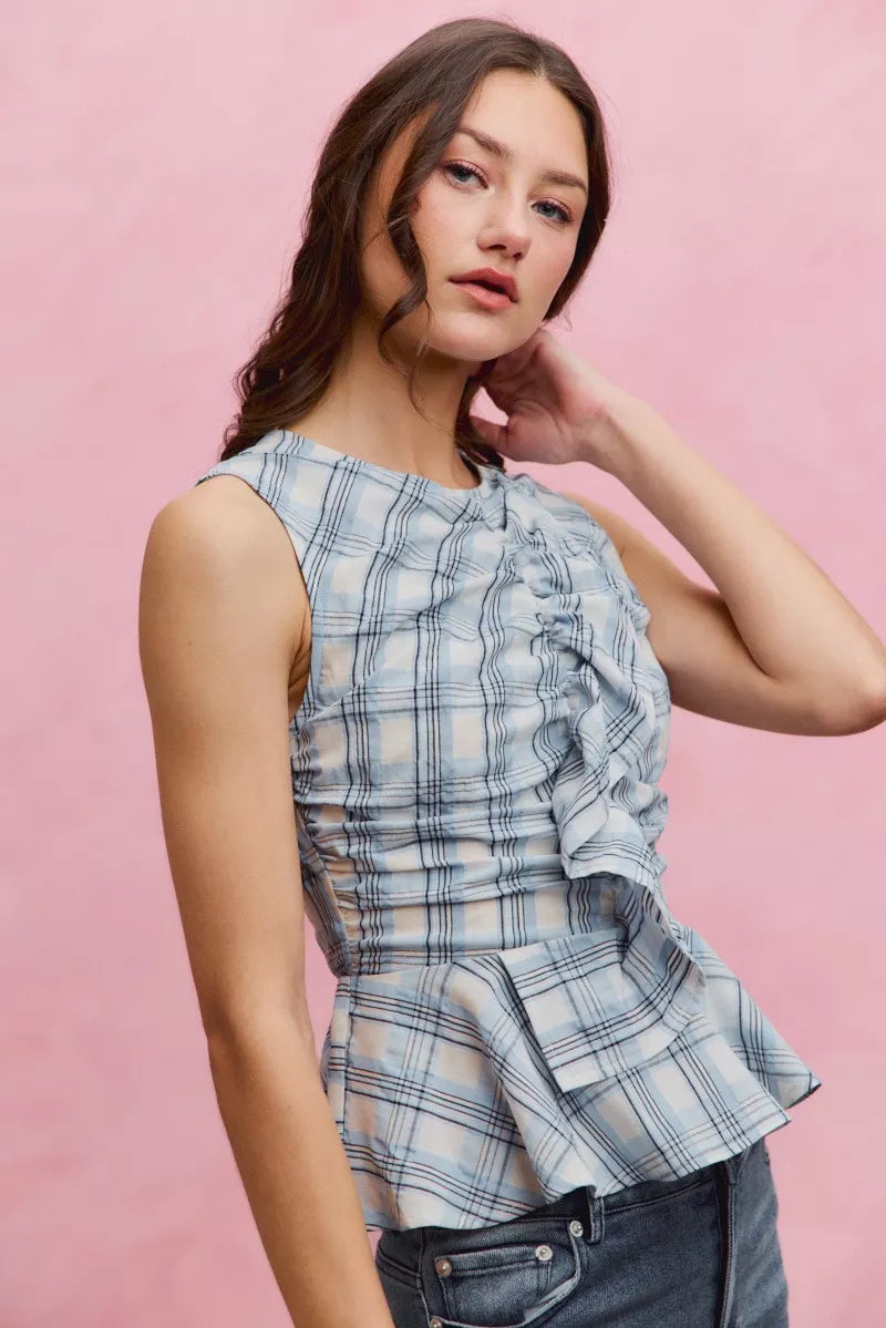 Blue plaid sleeveless ruffle peplum top front view