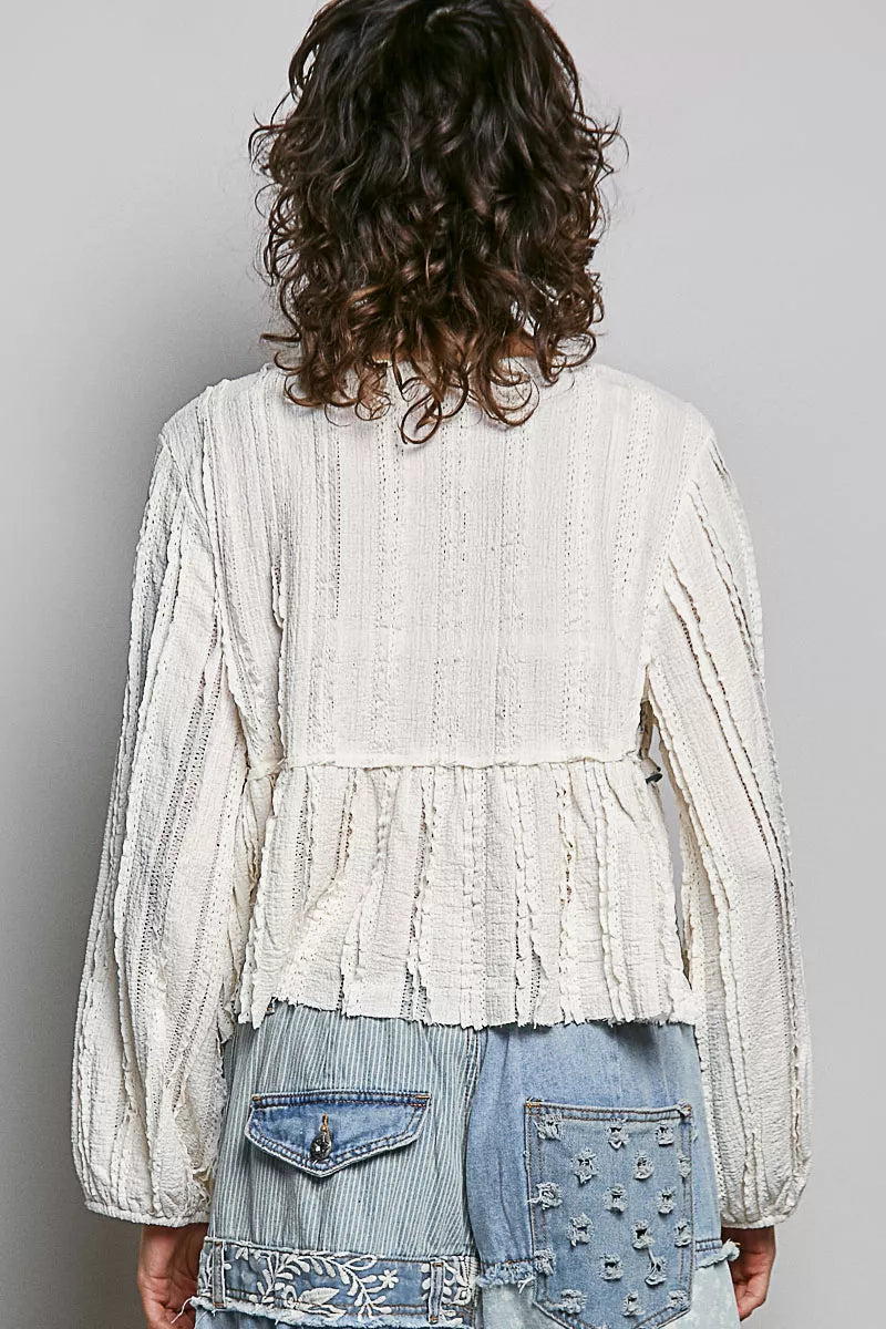 Balloon sleeve detail on cream lace top