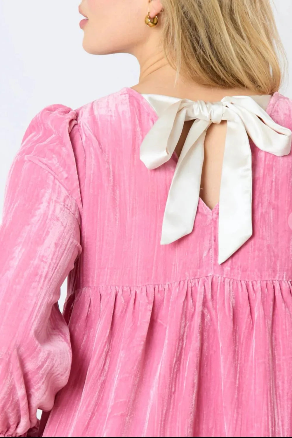 Round neck pink mini dress side view on model