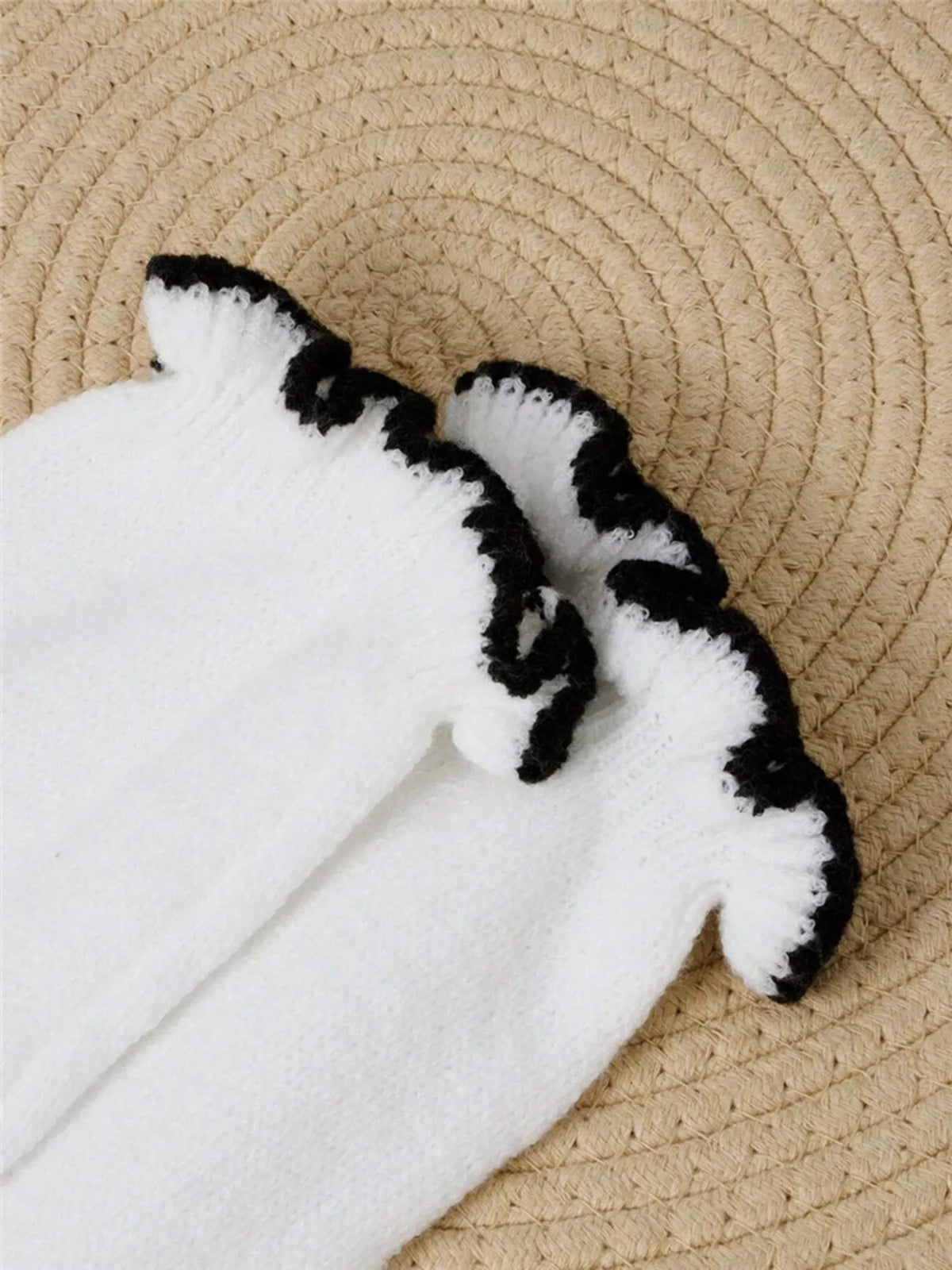 Ruffled trim button front sweater knit texture close up