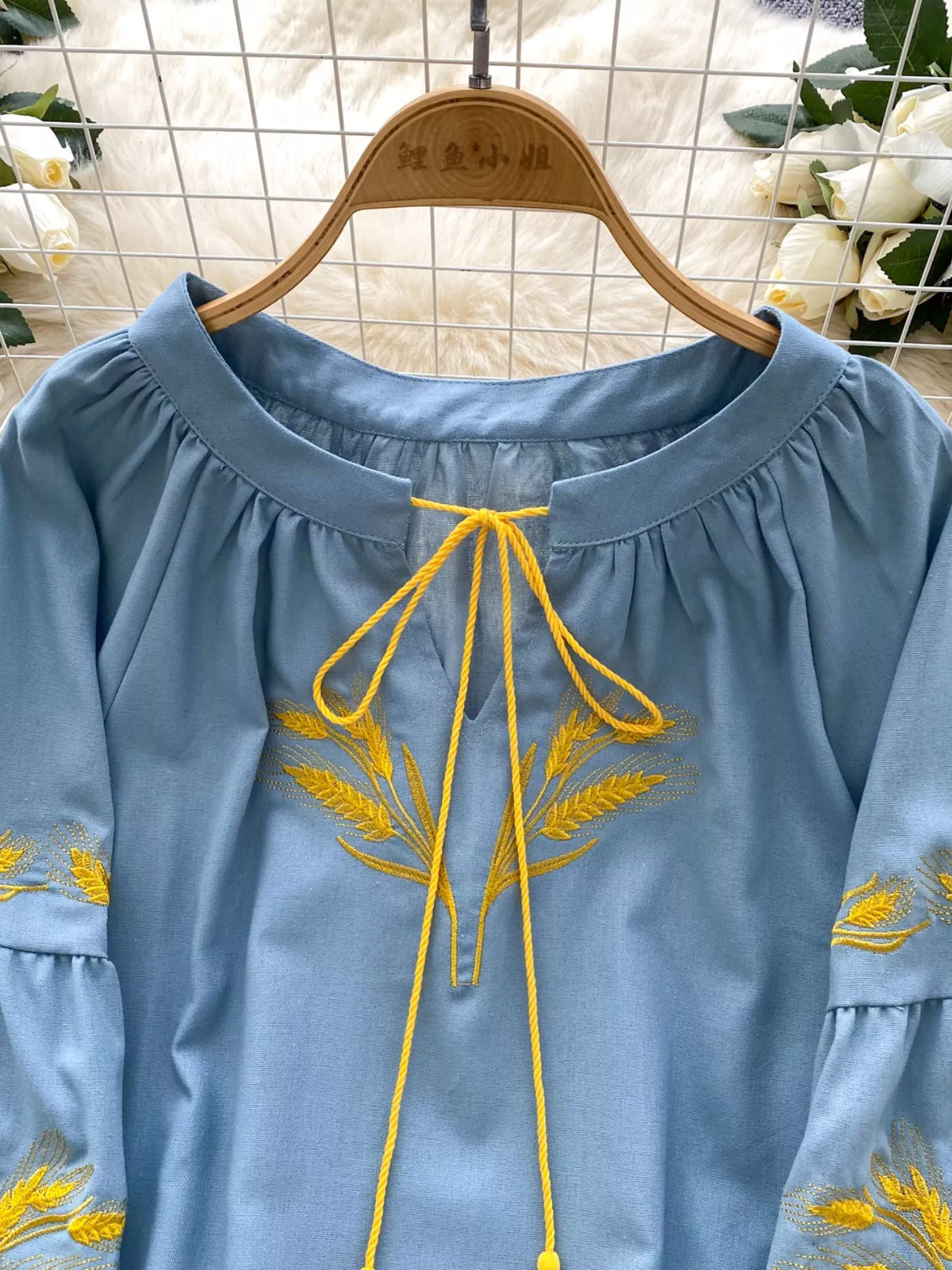 embroidered wheat pattern tie neck blouse fabric detail