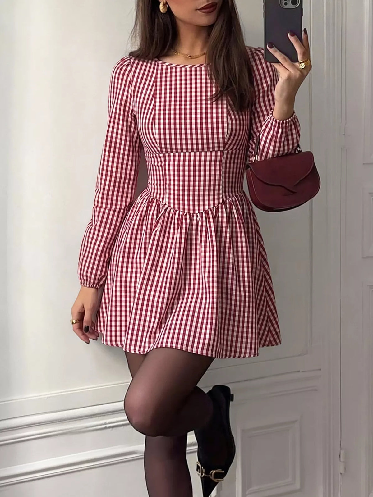 Close view of the red plaid check pattern and ruched detail