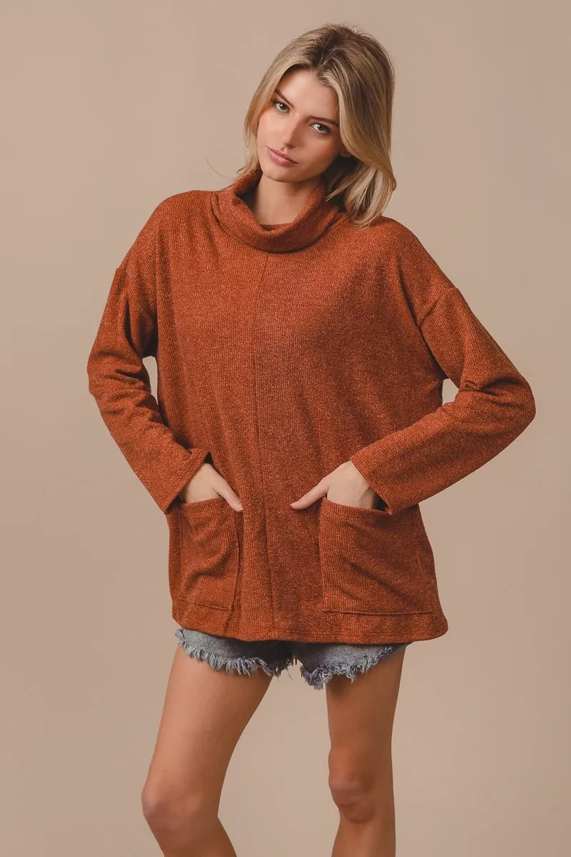 Ribbed Double Pocket Turtleneck Sweater in Rust close up
