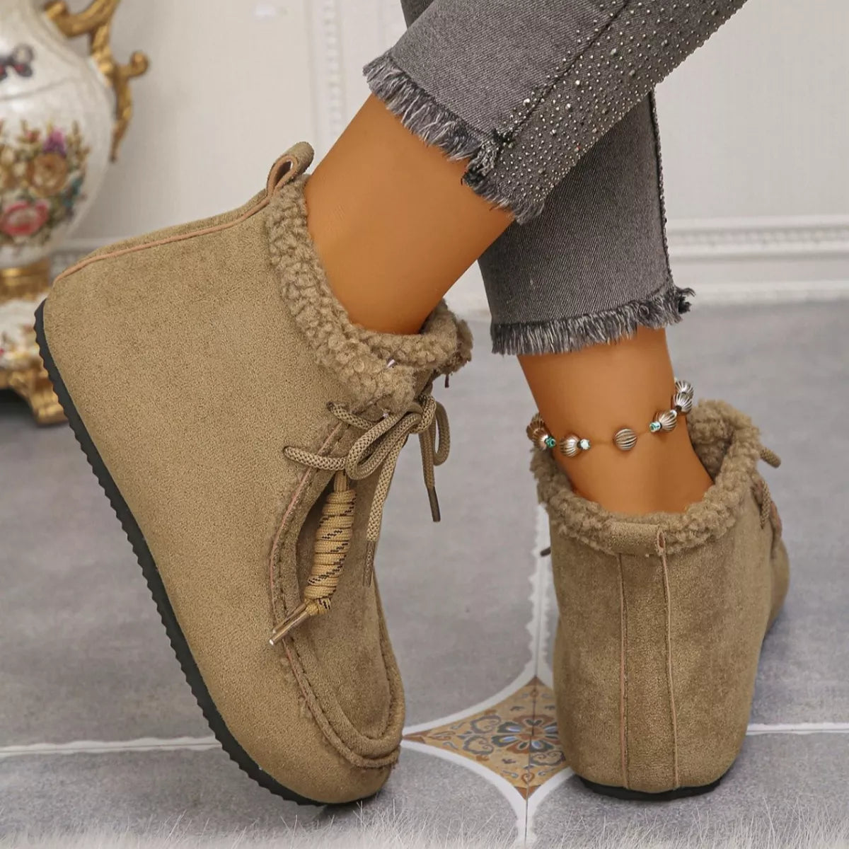 Plush lined ankle boots fastening detail