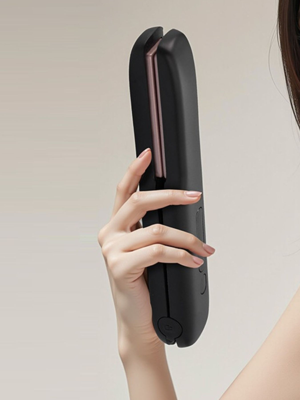 Straightener styling a strand of hair