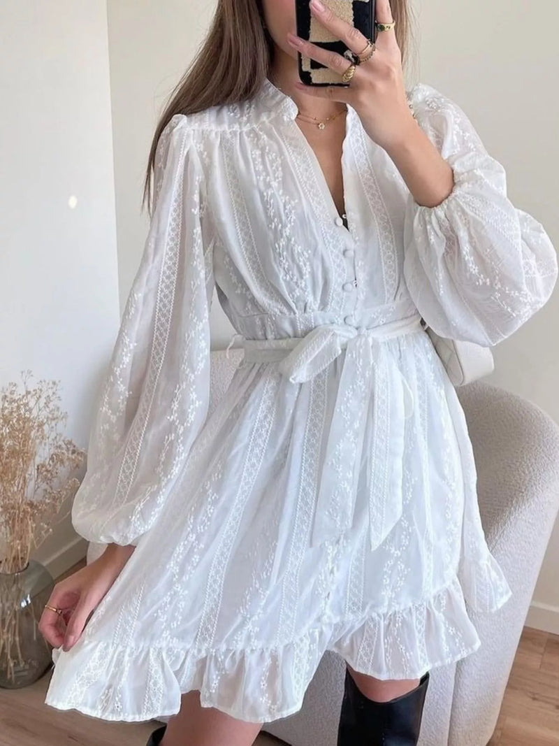 White ruffled hem tie waist long sleeve dress front view