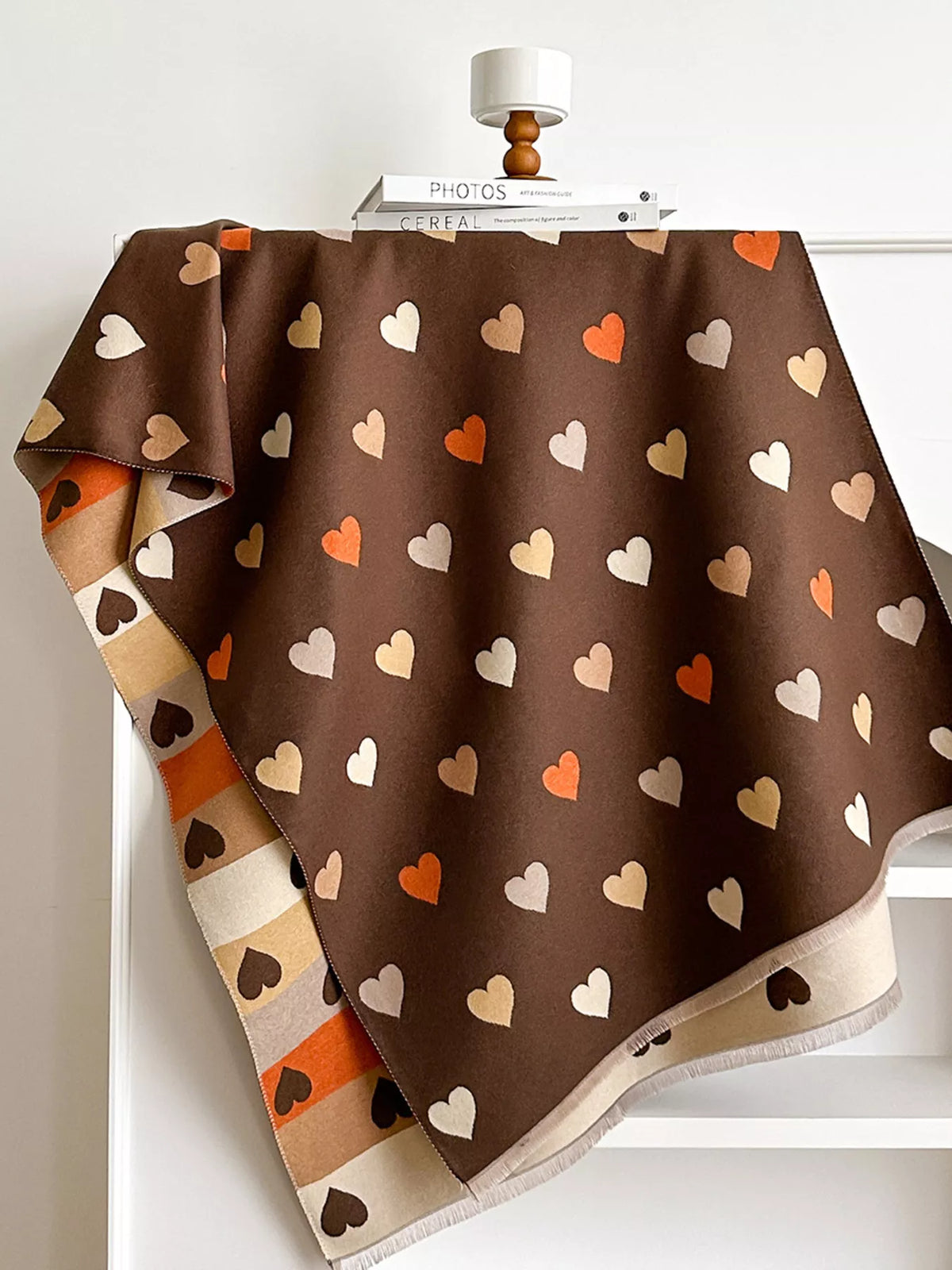 Cozy heart pattern scarf shown in natural light
