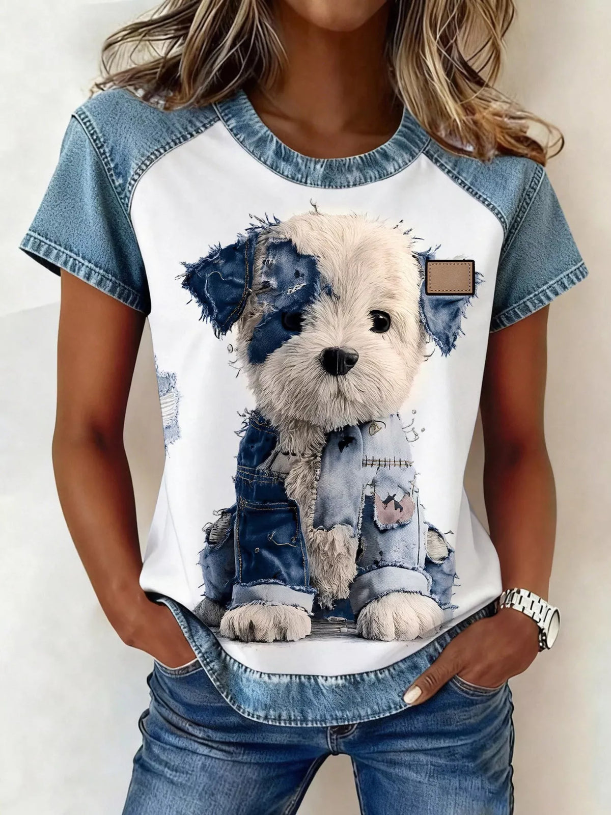 Blouse styled untucked over denim shorts