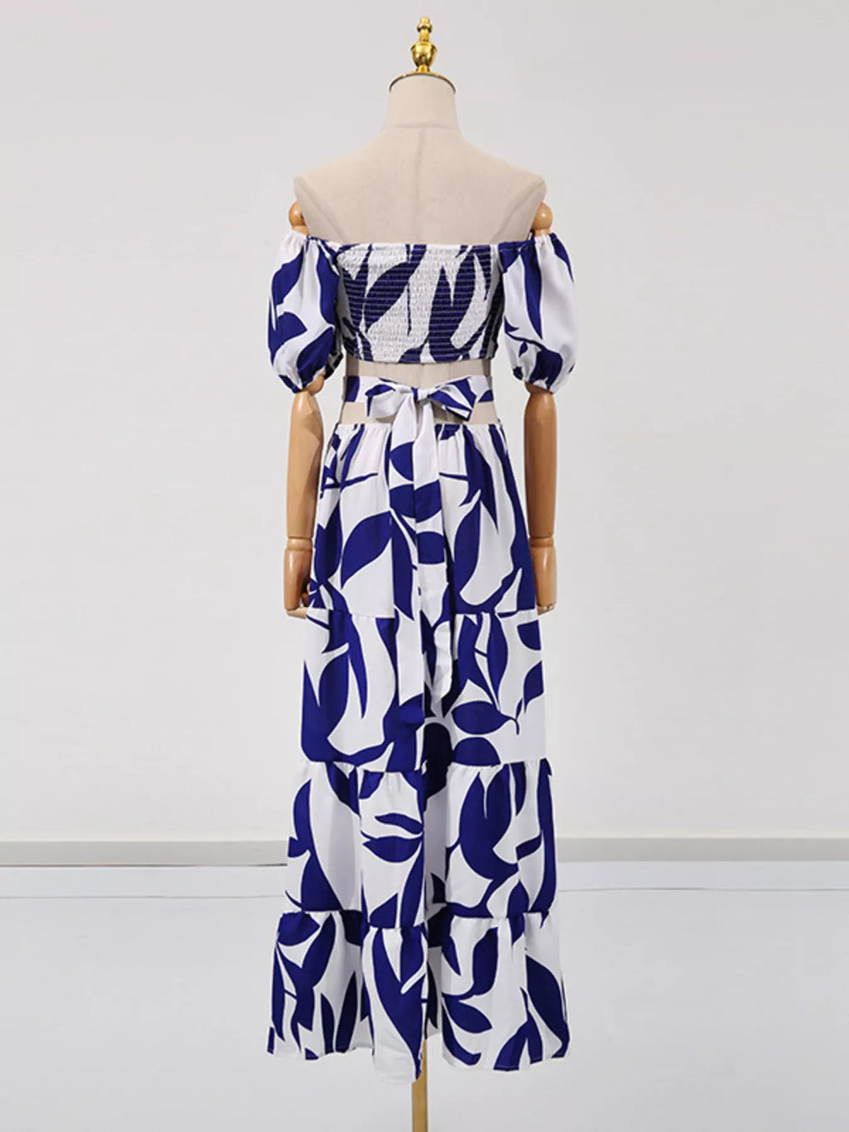 Off shoulder leaf print smocked maxi dress, seated styled view