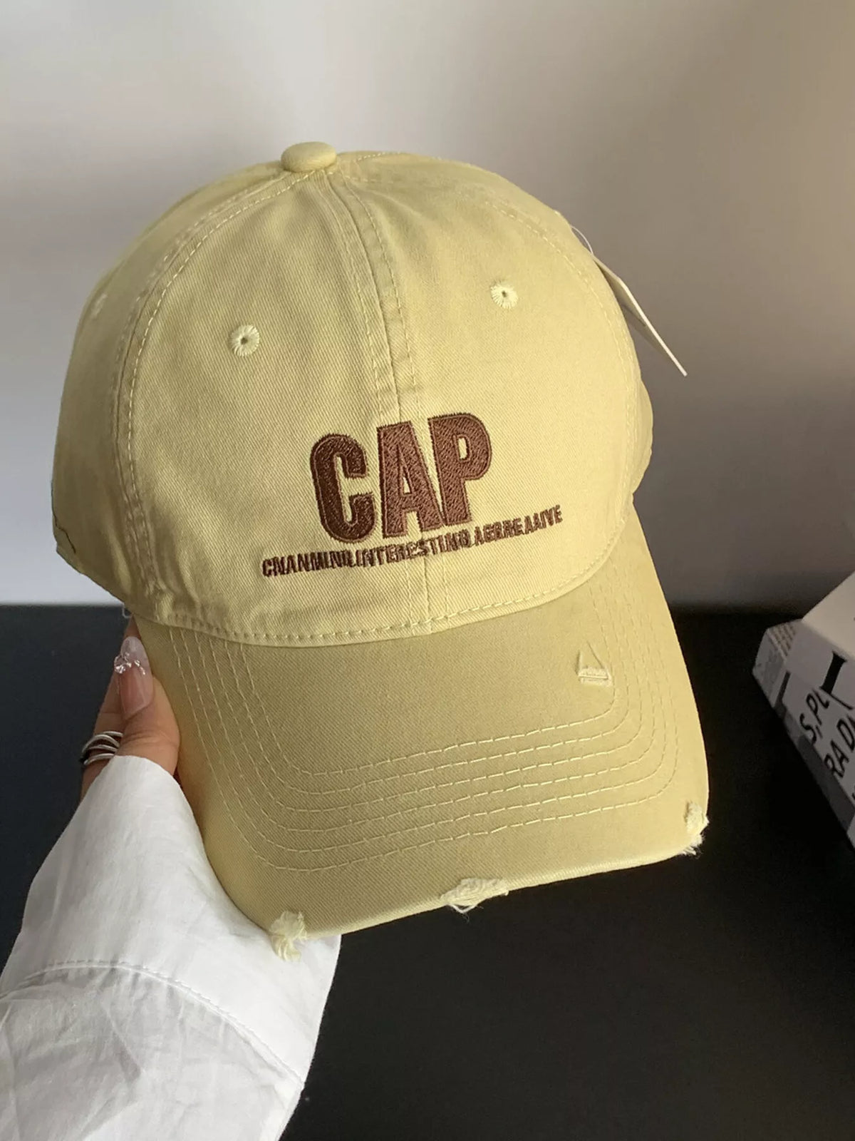 Distressed baseball cap shown in its four colour options