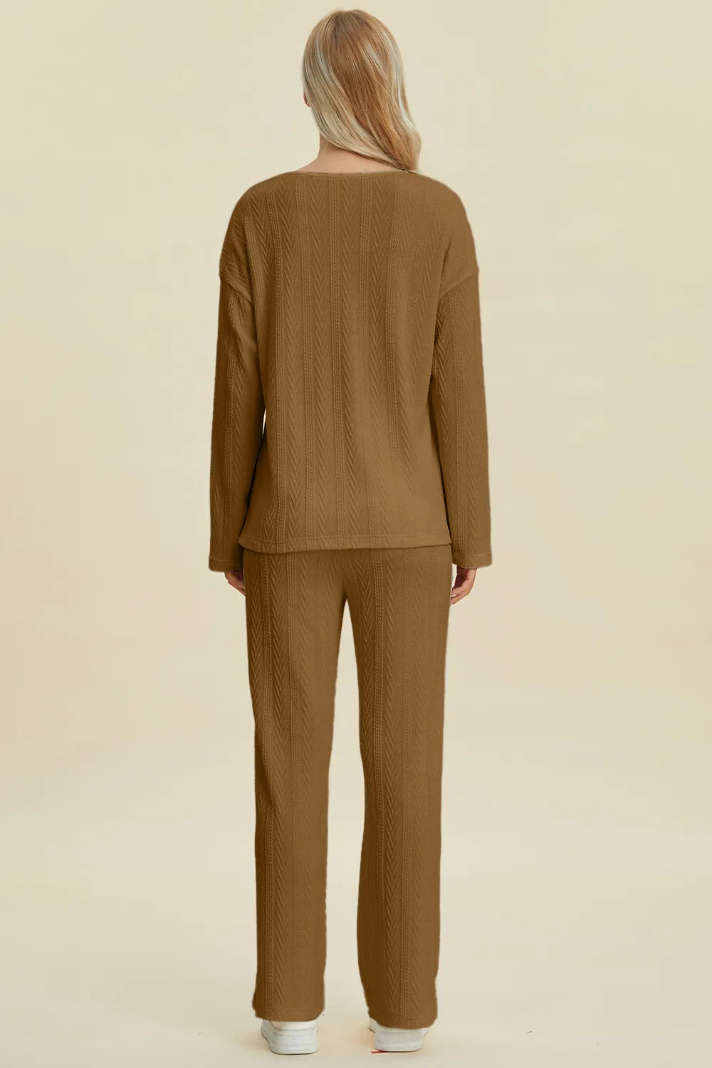 Styled view of the womens cable knit top and pants set
