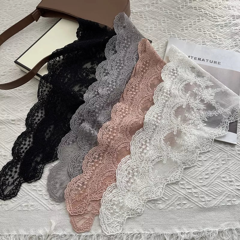 Delicate lace scarf draped over the shoulders