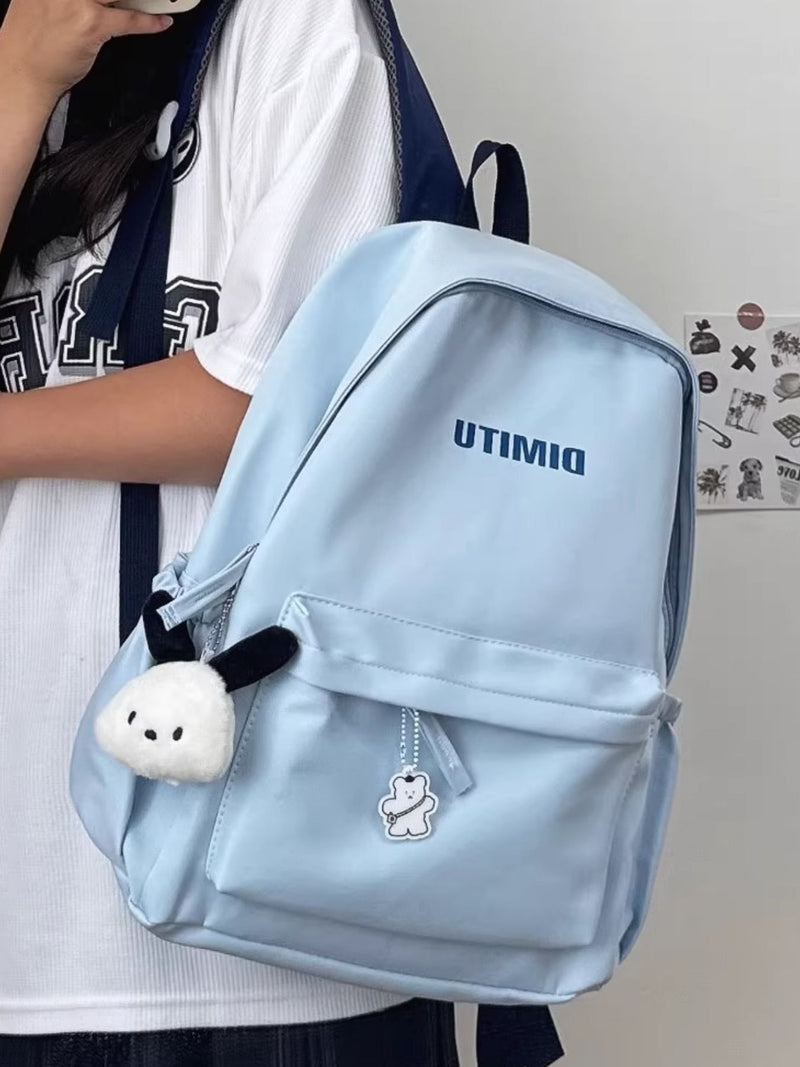 light blue nylon backpack front view