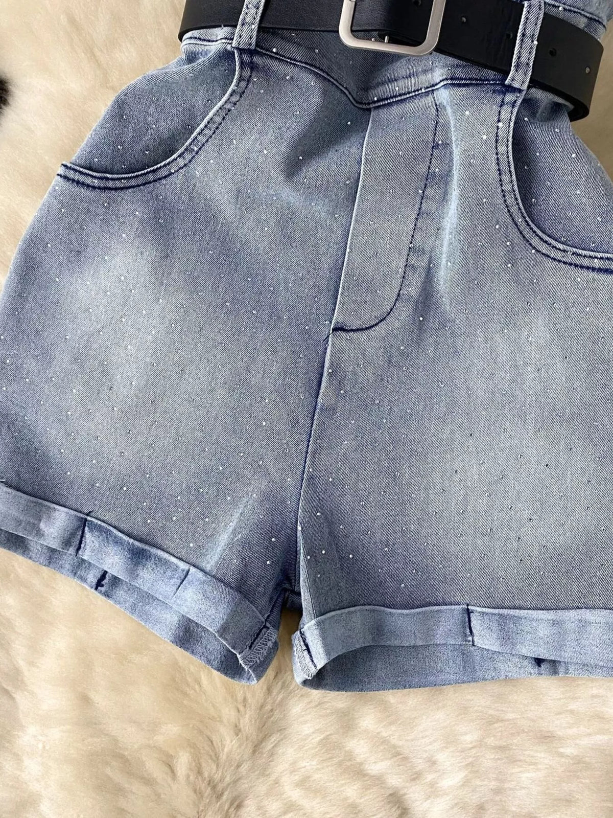 Blue strapless denim romper with diamante detail side view