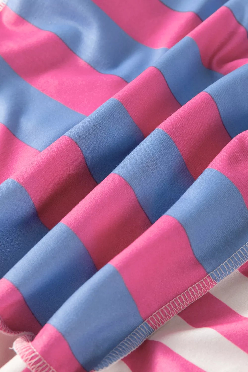 Full length styling view of the pink patchwork oversized top
