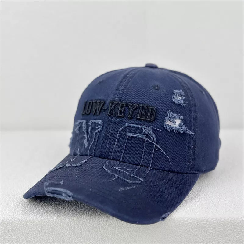 Distressed baseball cap shown in a caramel colorway