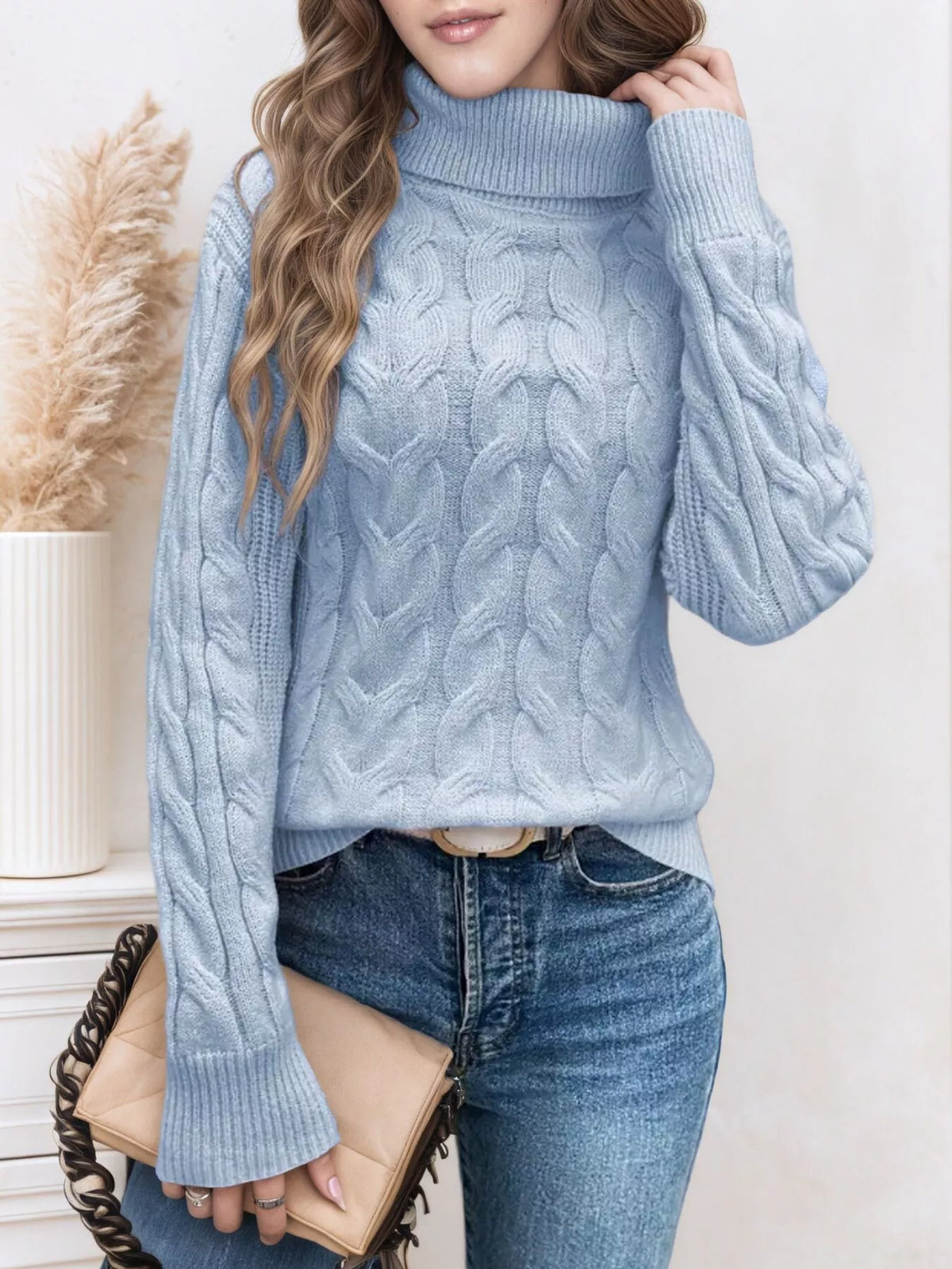 Cable knit turtleneck long sleeve sweater styled front view