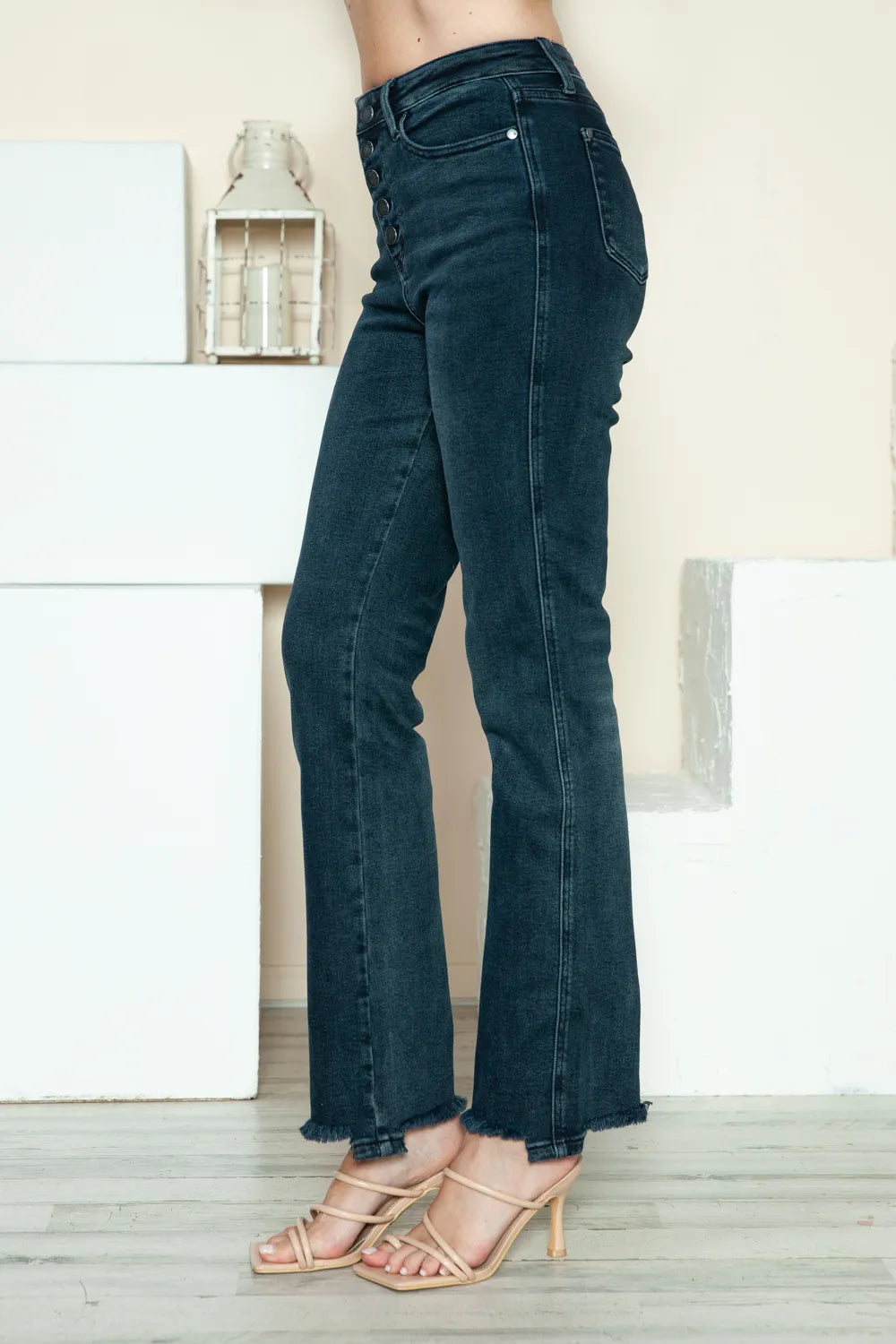 Detail of the distressed denim and raw hem