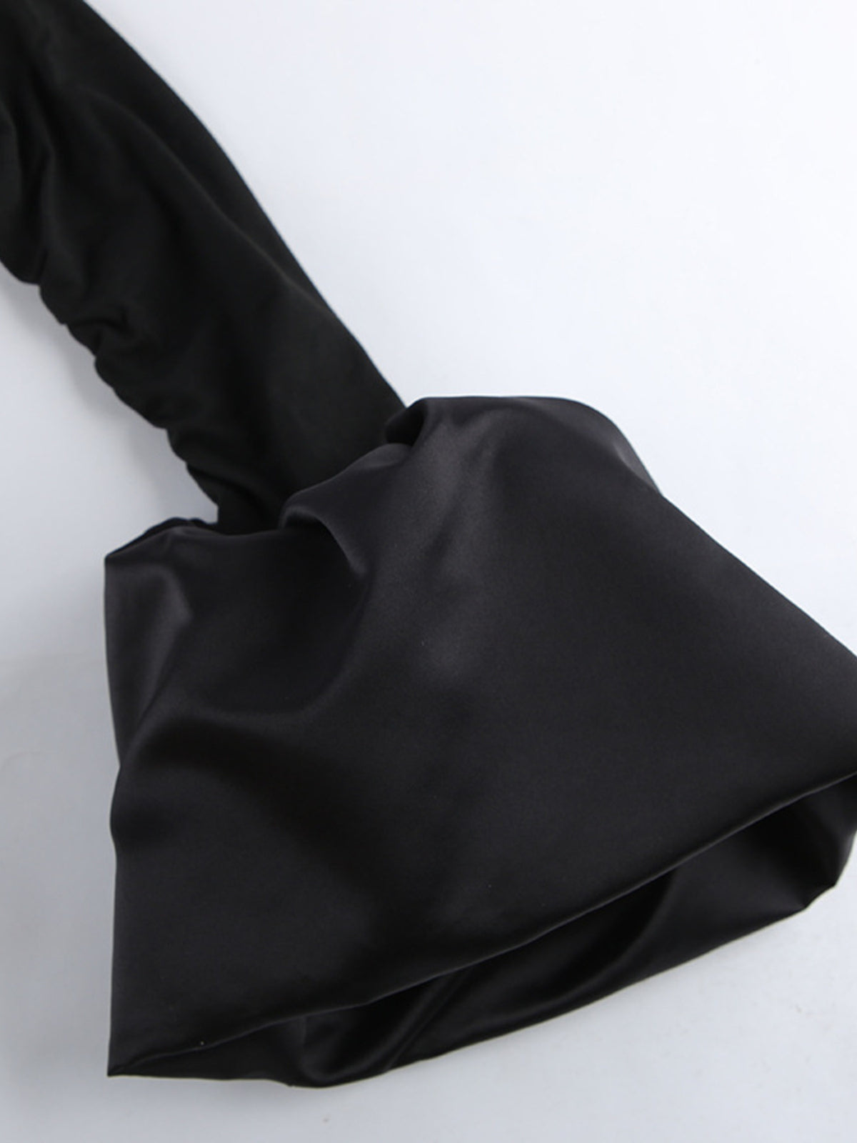 Black off shoulder ruffle hem mini dress neckline detail