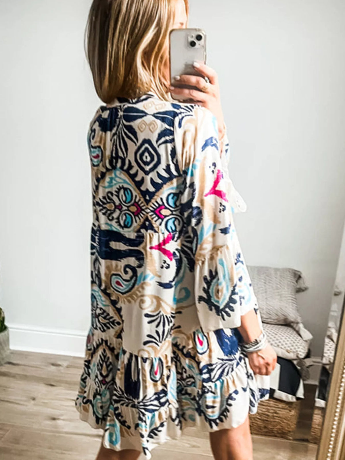 Tiered bohemian print dress shown from the back