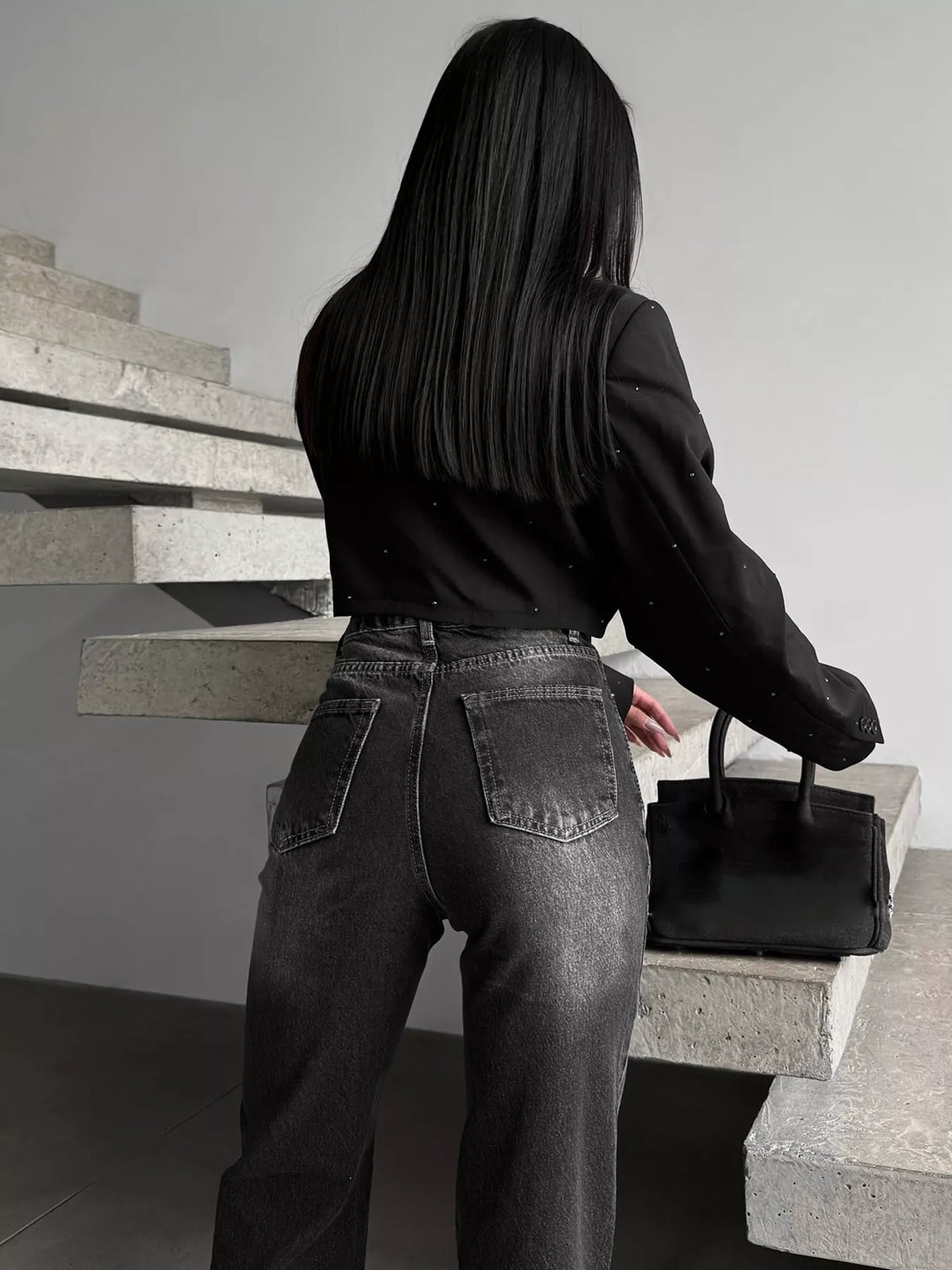 Side view of straight leg slit hem jeans