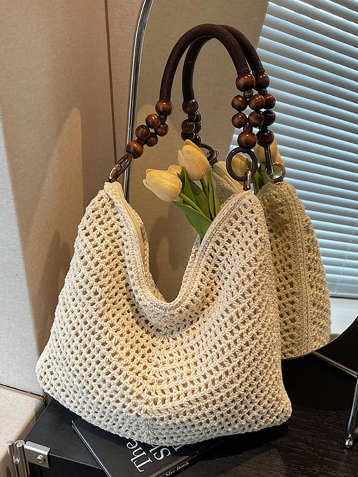 Knitted shoulder bag shown from the side