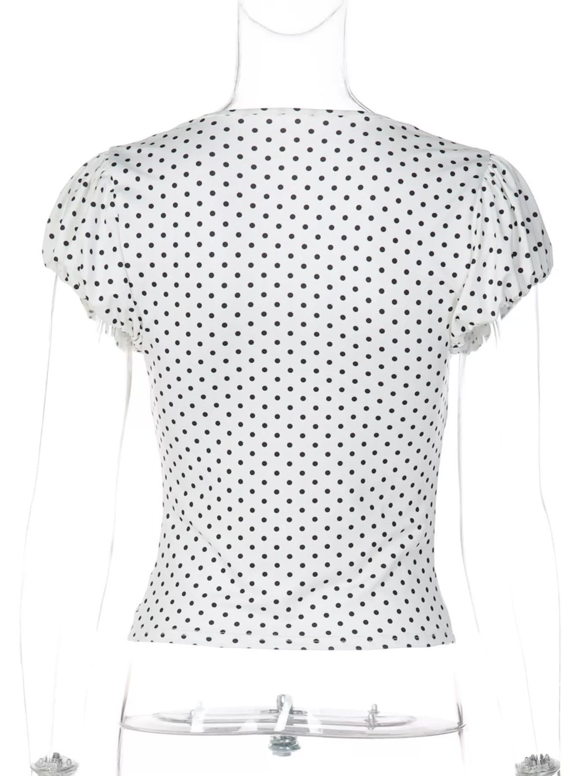 Shoulder and sleeve seam on the polka dot top