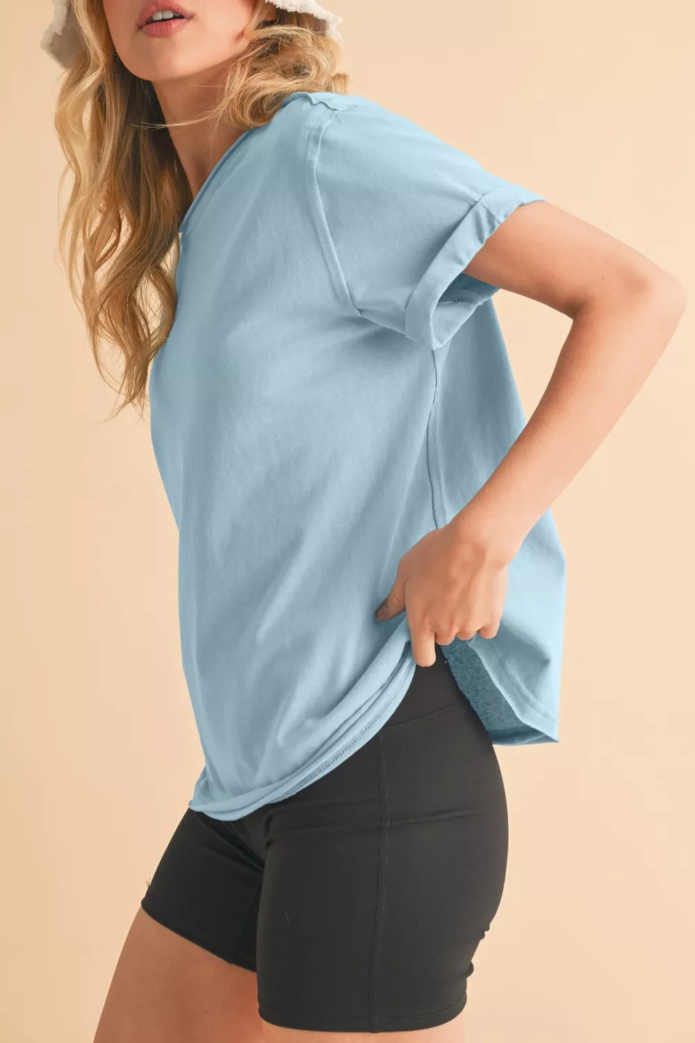 Loose light blue cotton tee shown on a model