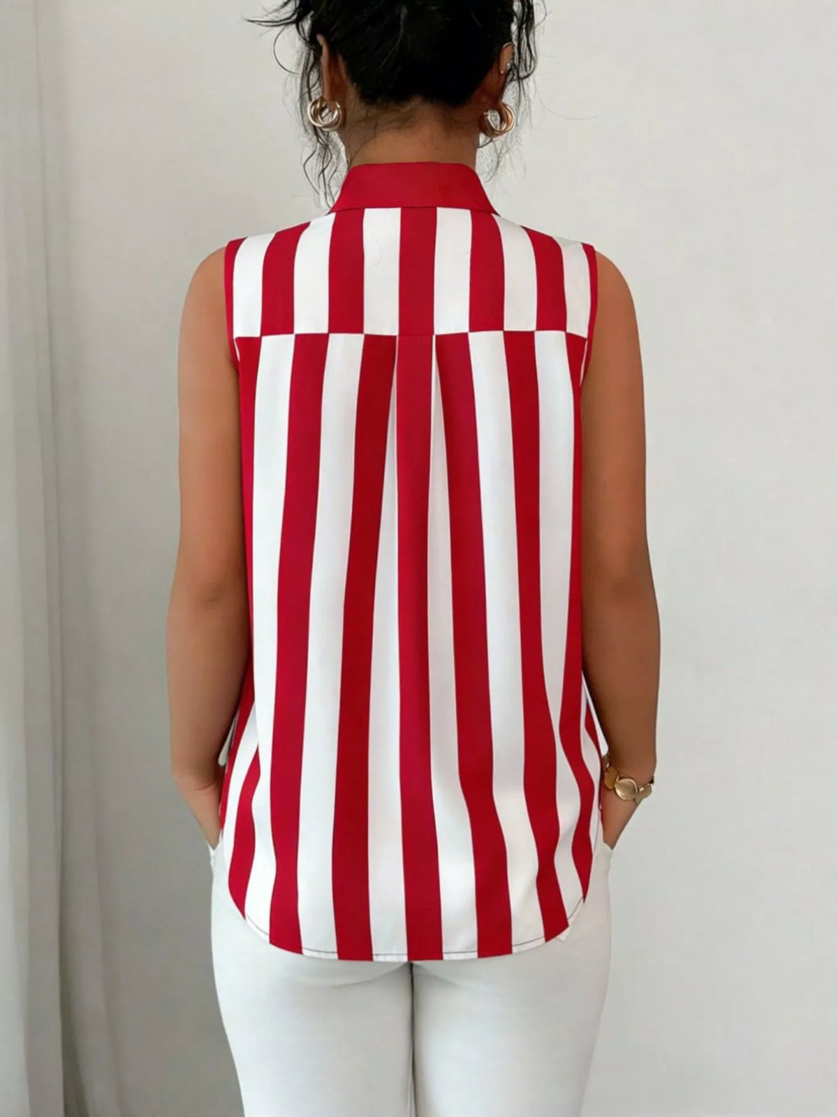 Button detail on a sleeveless shirt color option
