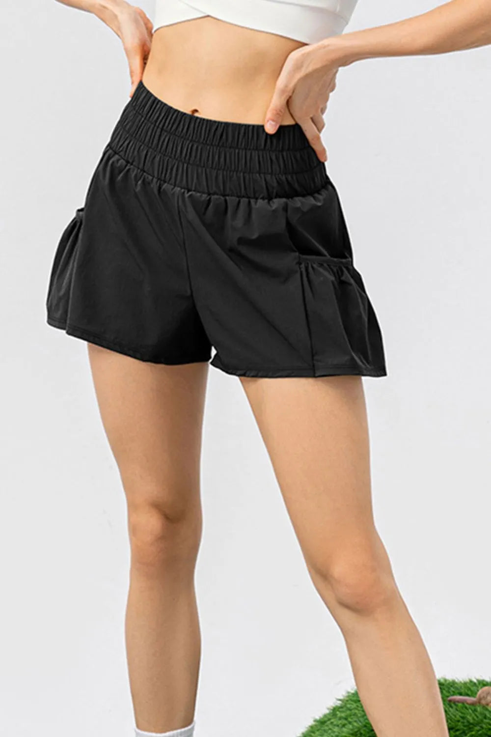 Elastic waist pocketed active shorts close up fabric detail
