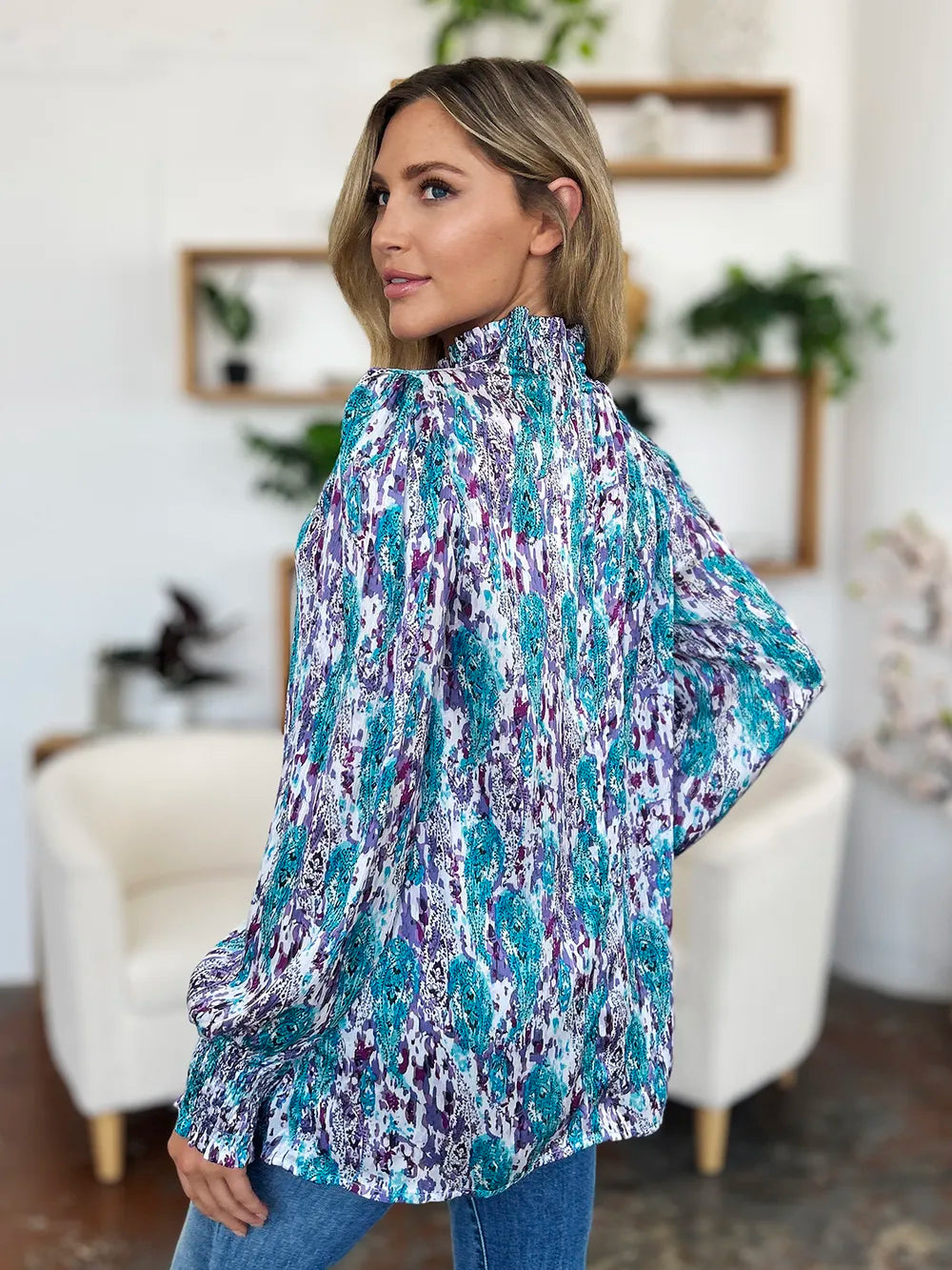 Movement view of the semi sheer blouse