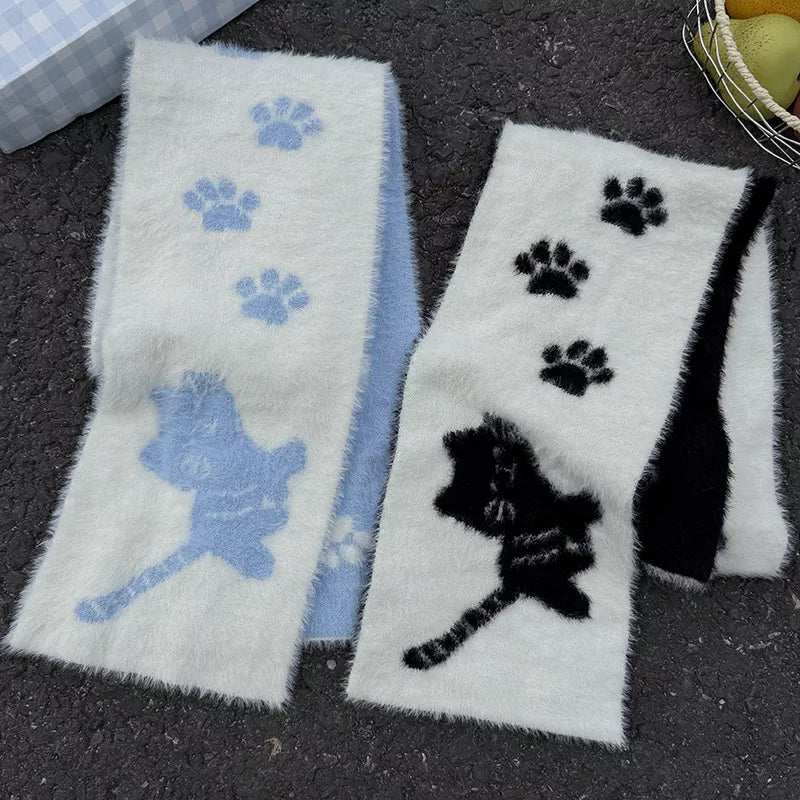 Close view of the cat paw print detail on the plush scarf