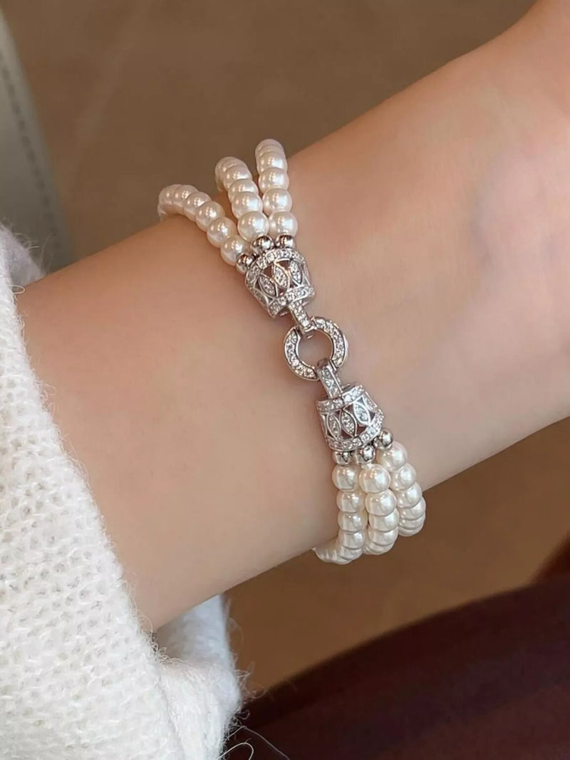 Silver three layers pearl bracelet on wrist