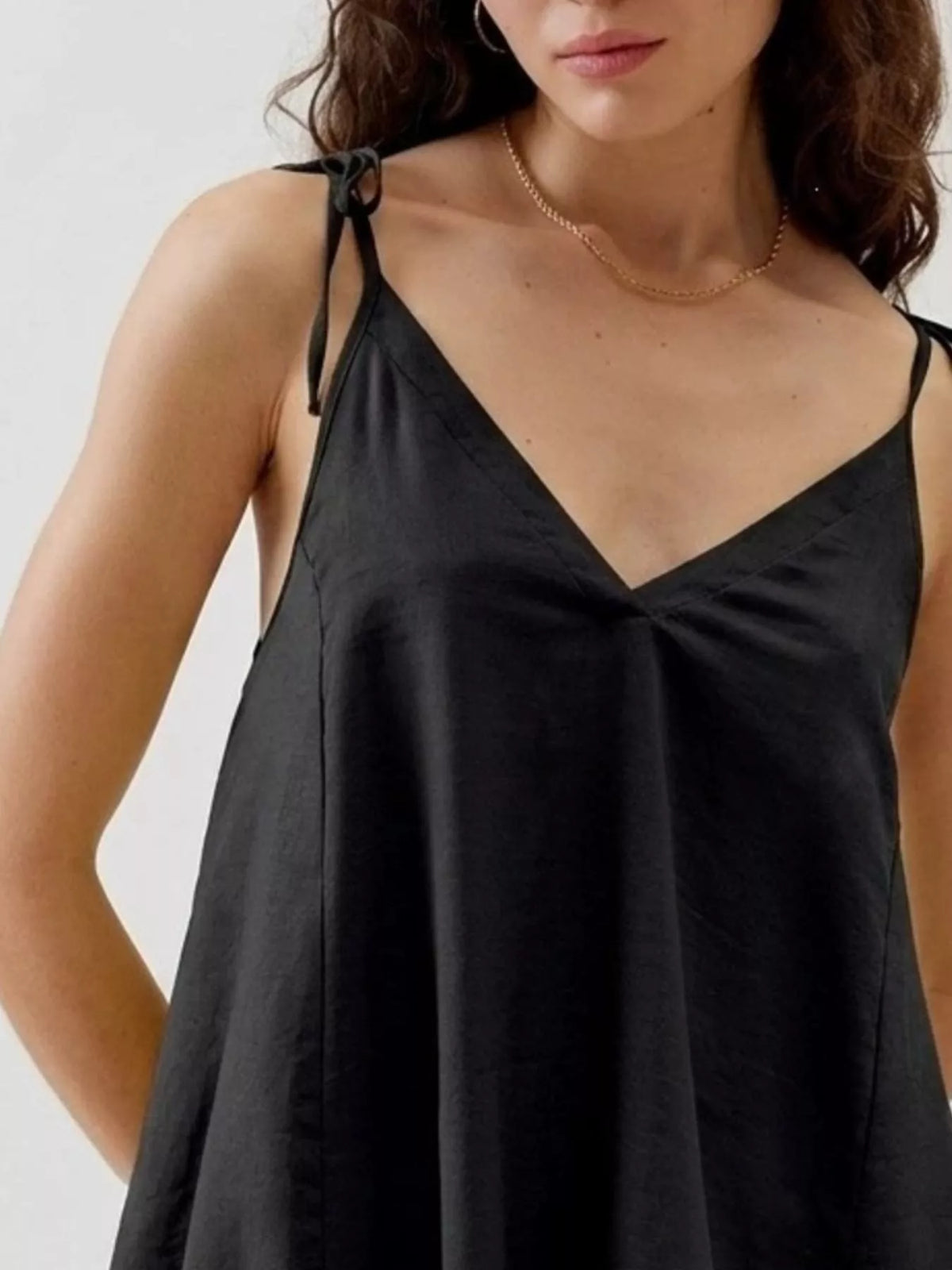 Tie strap ruffle hem cami detail view