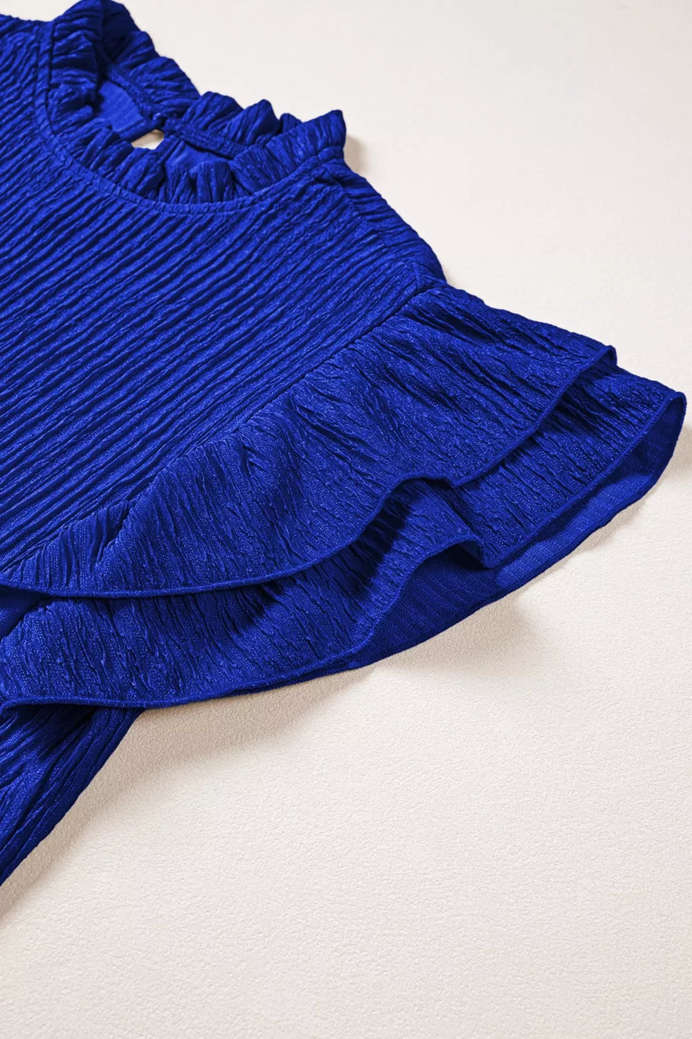 Navy textured ruffle trim short sleeve blouse full length view