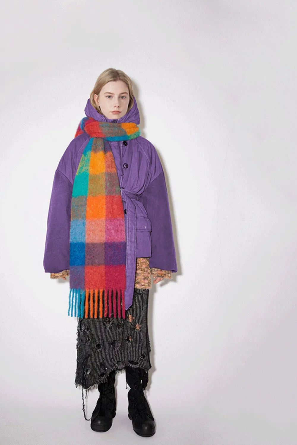Warm plaid scarf styled over a winter coat