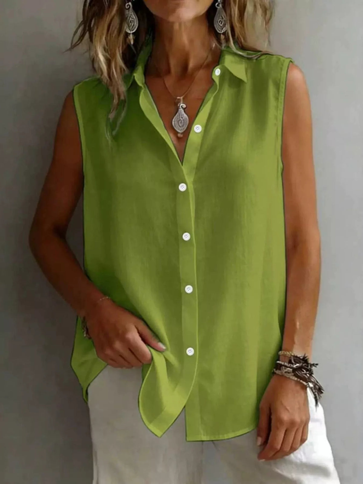Sleeveless collared button down shirt front view
