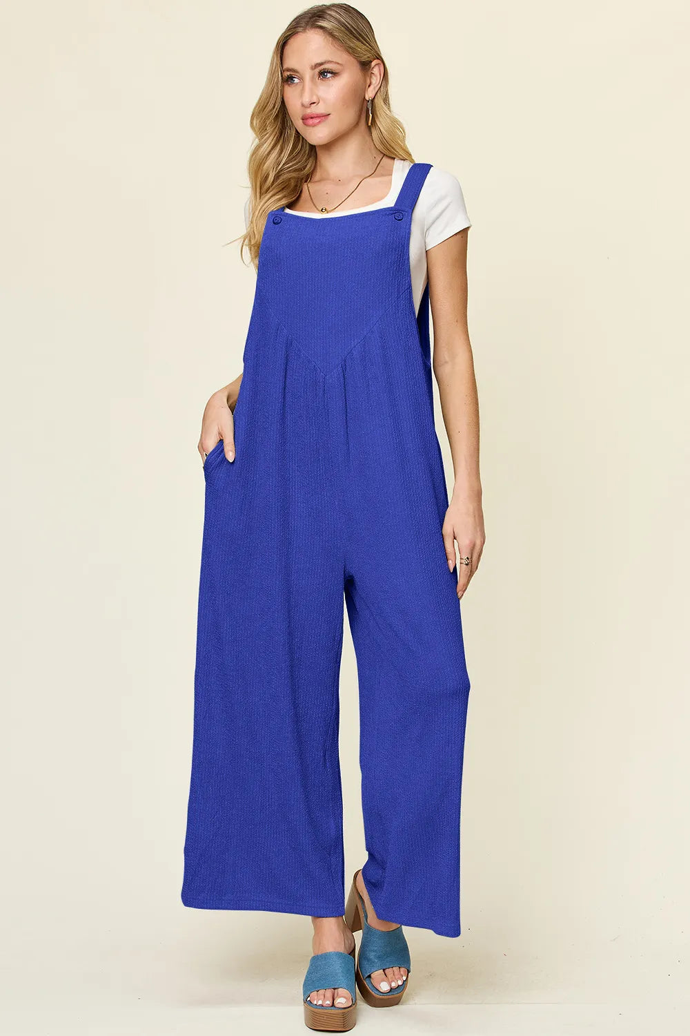 Wide leg overall styled on model