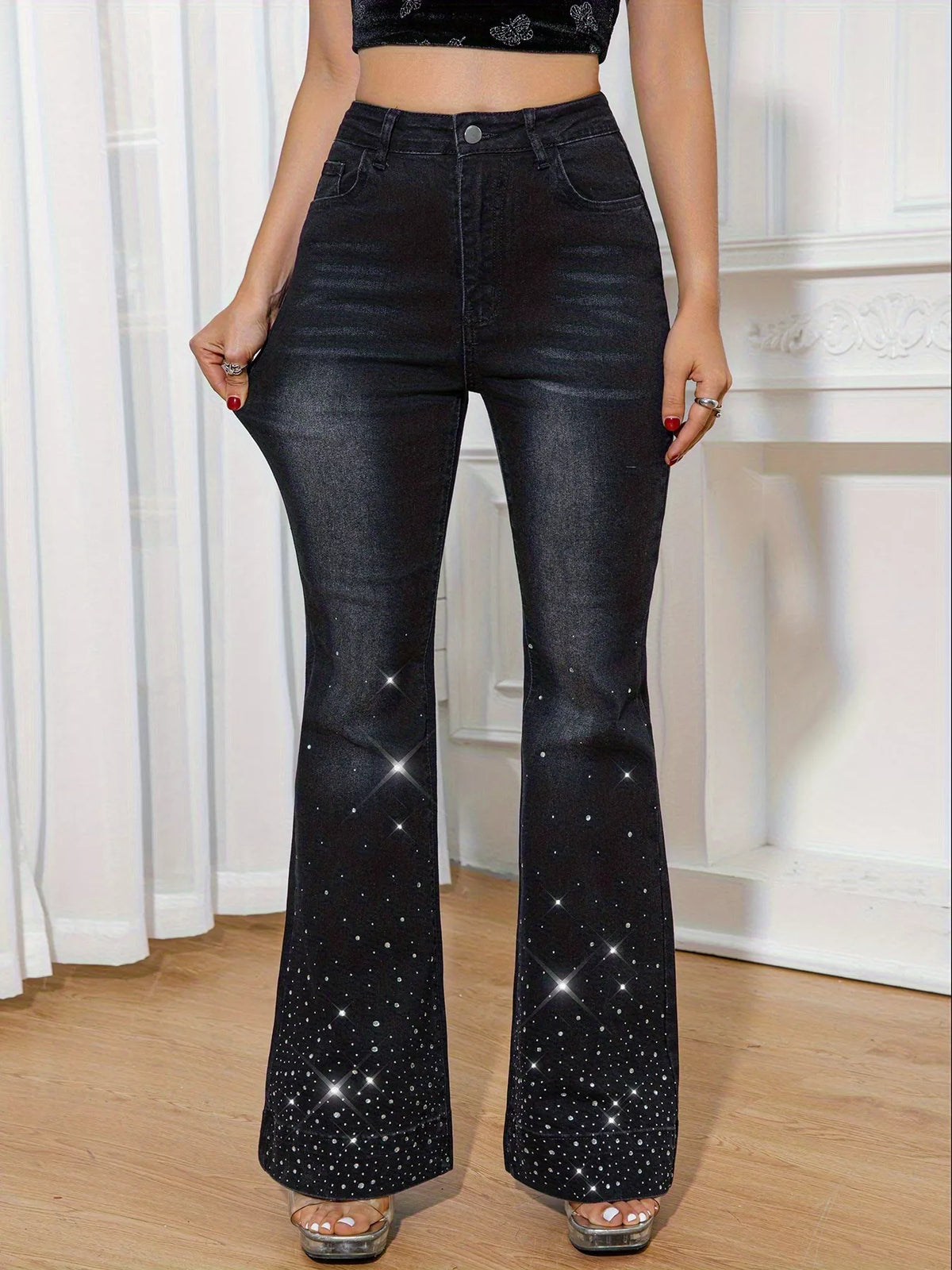 Rhinestone embellished black flare jeans front view